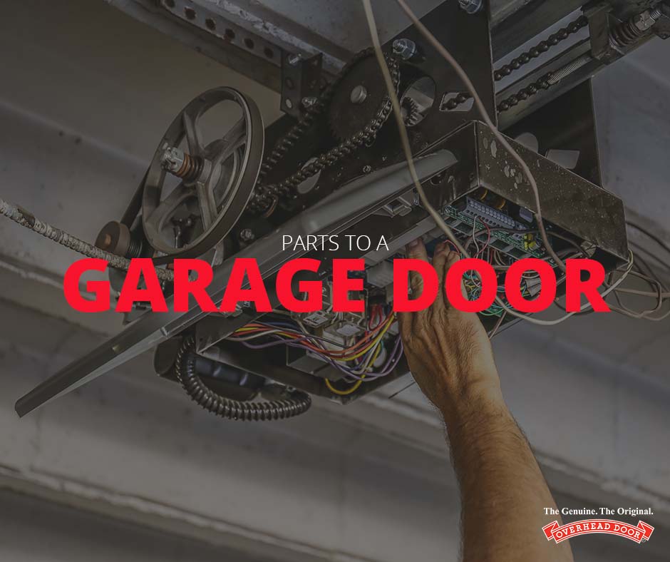 Man reaching hand up to fix garage door motor