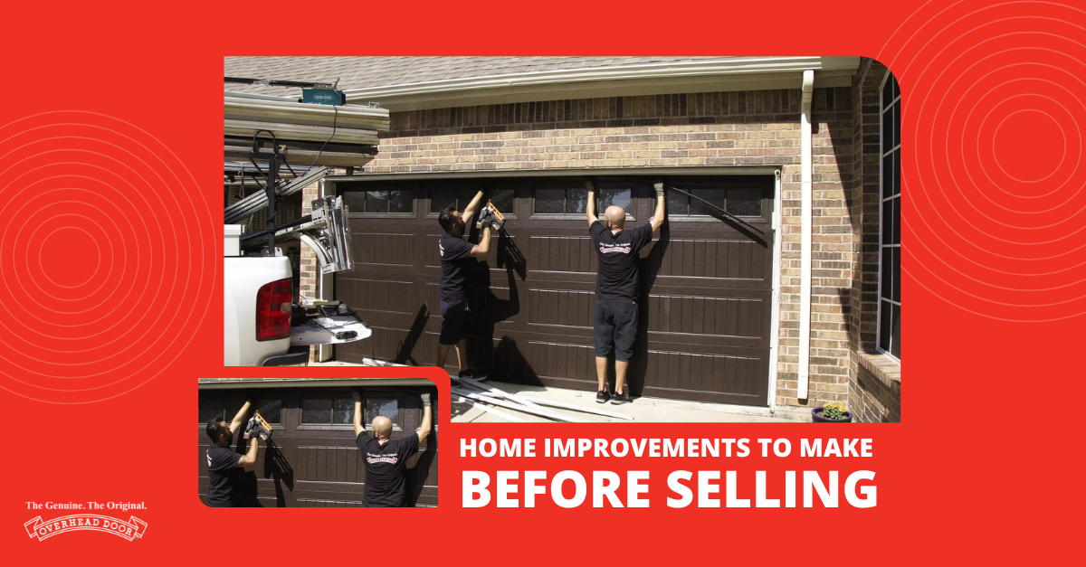 Two men repairing a brown garage door