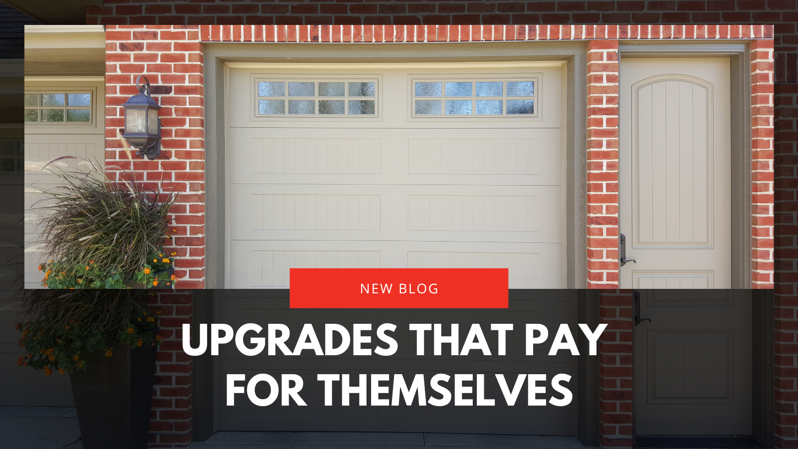 White garage door with windows on a brick house. 