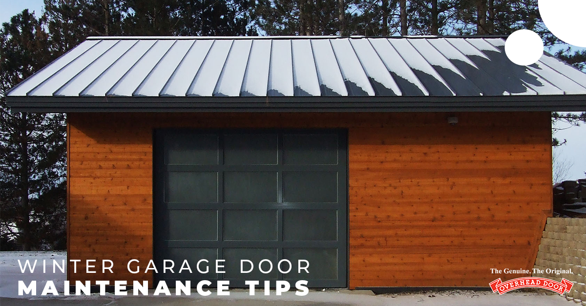 Black and Wood Garage With a Snow Covered Roof